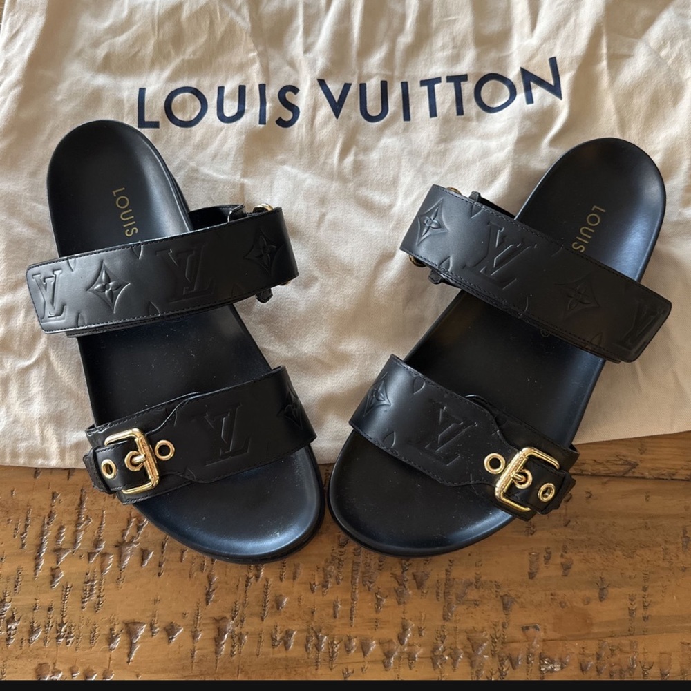 Gently used authentic Louis Vuitton slide sandals. Black leather. Size 7